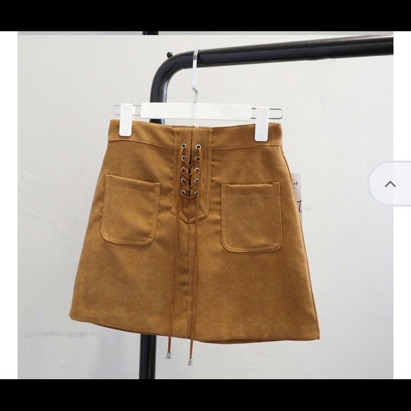 Two lace-up mini skirts - Picture 4 of 8